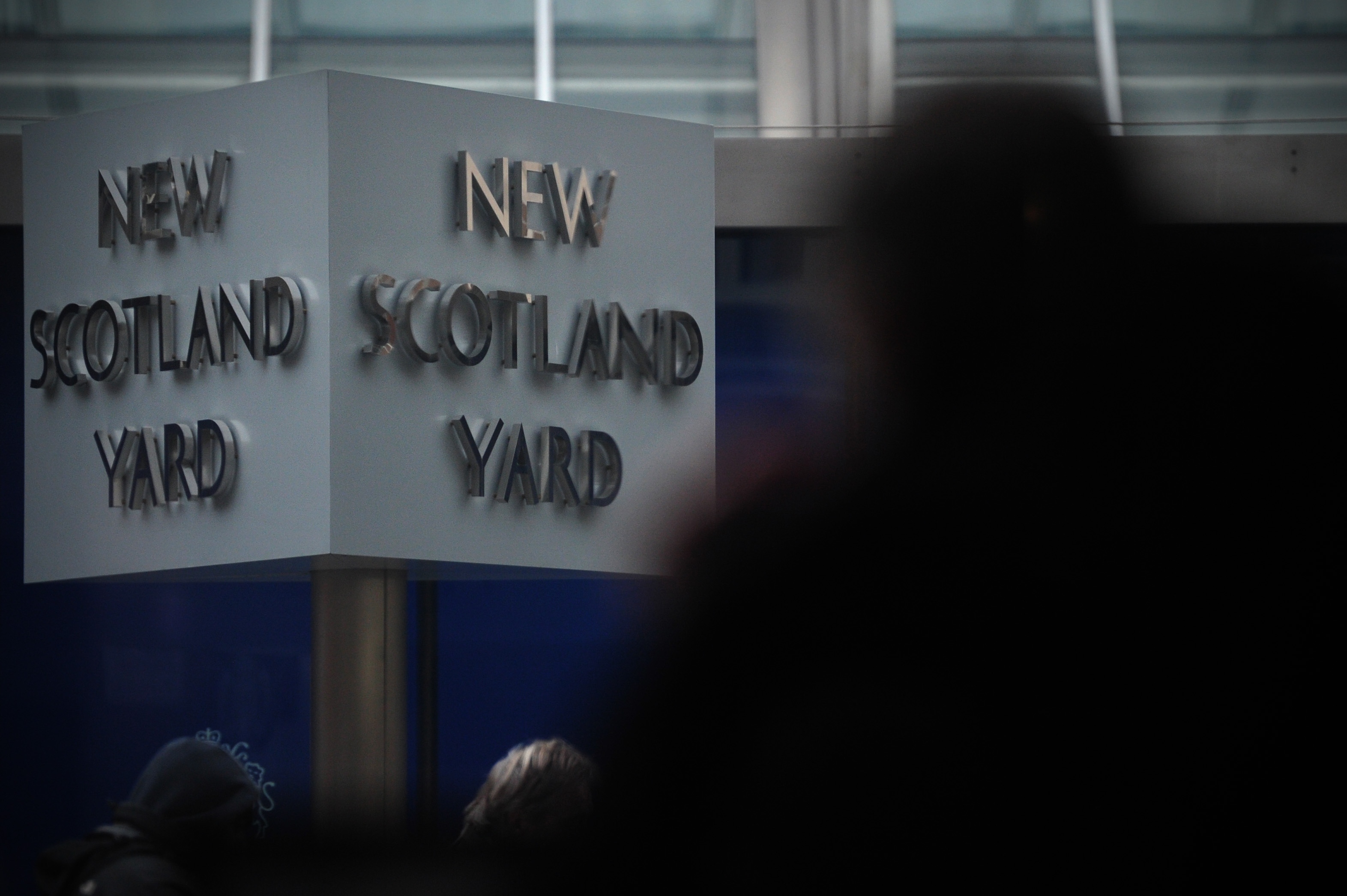 The New Scotland Yard sign stands outside the headquarters of the Metropolitan Police, in central London on January 11, 2013, following the report by the Metropolitan Police and NSPCC (National Society for the Prevention of Cruelty to Children) detailing 50 years of allegations of sexual abuse by former BBC presenter Jimmy Savile. British police said that late BBC star presenter Jimmy Savile was a predatory sex offender whose victims were as young as eight and who preyed on children and adults in hospitals and even a hospice. A report by police and child protection authorities found that the TV presenter, who was one of the biggest TV stars in Britain in the 1970s and 1980s, used his celebrity status to "hide in plain sight". AFP PHOTO/CARL COURT (Photo credit should read CARL COURT/AFP/Getty Images)